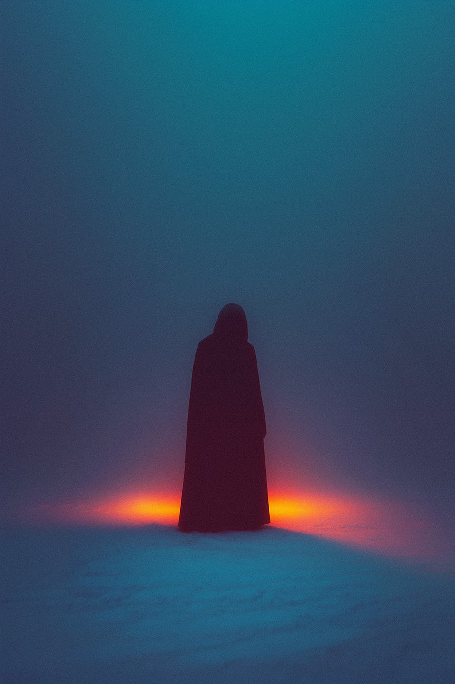 A mysterious hooded person in a dreamy winter landscape. A warm, orange light in front of the character is breaking through the blue, cold fog of the empty environment. | Wall Art